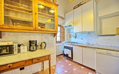 Fattoria: Property, Room, Yellow, Kitchen, Countertop, Furniture, Cabinetry, Building, Interior Design, House