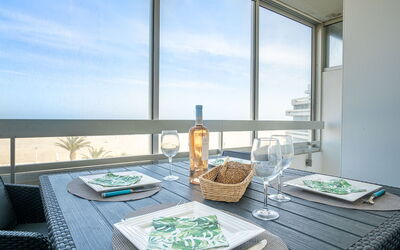 Canet-Plage 710: Sky, Table, Property, Cloud, Tableware, Window, Bottle, Building, Azure, Textile