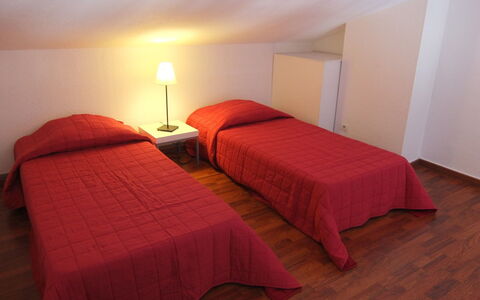 Le Central Beach: Bed, Bedroom, Furniture, Room, Bed Sheet, Property, Bedding, Red, Bed Frame, Floor