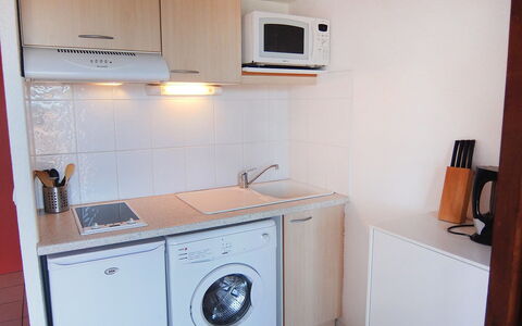 Le Central Beach: Room, Property, Major Appliance, Laundry Room, Kitchen, Cabinetry, Home Appliance, House, Clothes Dryer, Furniture