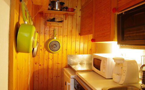 Chamonix 210: Room, Furniture, Interior Design, Wood, House, Cabinetry, Building, Kitchen
