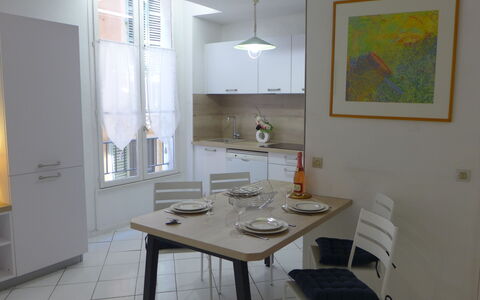 Vieux Nice: Table, Furniture, Building, Wood, Interior Design, Floor, Flooring, House, Chair, Lamp
