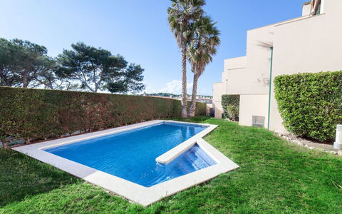 Empuries Beach: Plant, Daytime, Property, Sky, Light, Azure, Nature, Tree, Rectangle, Building