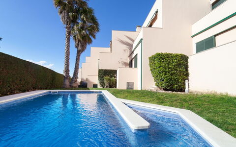 Empuries Beach: Water, Plant, Building, Property, Daytime, Sky, Azure, Blue, Tree, Swimming Pool