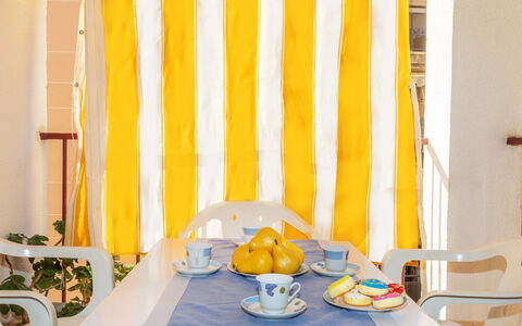 Edificio Garcomar i: Yellow, Textile, Furniture, Linens, Curtain, Chair, Window Covering, Window Treatment, Swimming Pool, Outdoor Furniture