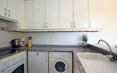 Alma del Sol: Property, Room, Kitchen, Cabinetry, Countertop, Major Appliance, House, Furniture, Interior Design, Laundry Room