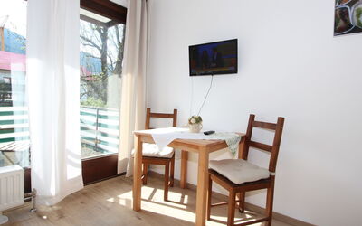 Liebl 202.4: Table, Furniture, Property, Picture Frame, Building, Wood, Chair, Flooring, Interior Design, Living Room