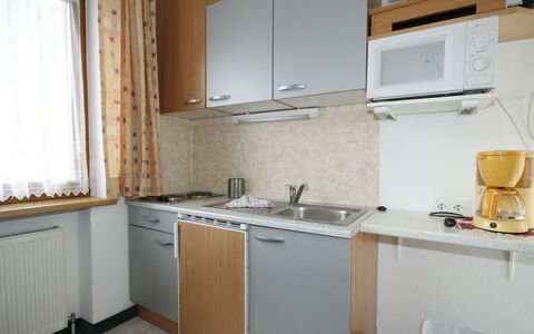 Längenfeld 100: Property, Room, Kitchen, Furniture, Cabinetry, Building, Countertop, House, Interior Design, Kitchen Stove