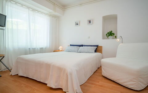 Emil: Bedroom, Bed, Furniture, Room, Bed Sheet, Mattress, Bedding, Property, Bed Frame, Interior Design