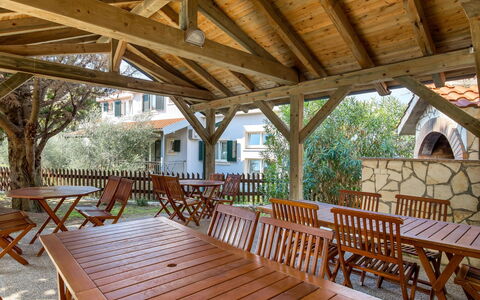 Rab Kampor 631: Furniture, Property, Table, Wood, Tree, Outdoor Furniture, Shade, Interior Design, Chair, Porch