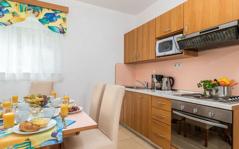 Lucija: Room, Property, Yellow, Furniture, Kitchen, Interior Design, Turquoise, Building, Real Estate, House