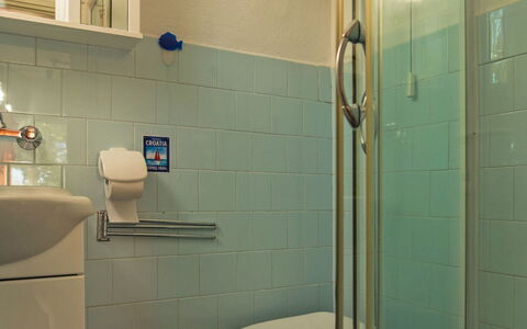 Dada: Bathroom, Tile, Room, Property, Wall, Plumbing Fixture, Bathroom Accessory, Tap, Ceramic, Toilet