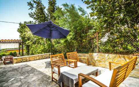 Marija: Plant, Property, Furniture, Sky, Table, Building, Botany, Shade, Tree, Outdoor Furniture