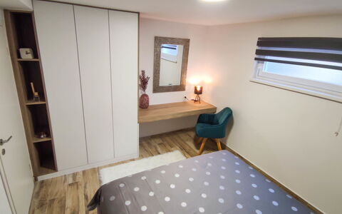 Milka: Furniture, Property, Comfort, Building, Television, Bed Frame, Cabinetry, Table, Wood, Textile