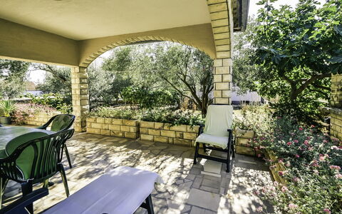 Marija: Plant, Furniture, Property, Shade, Chair, Architecture, Building, Outdoor Furniture, Tree, Leisure