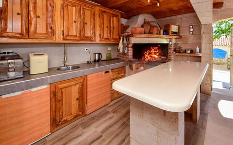 Trogir Okrug Gornji 330: Countertop, Cabinetry, Property, Furniture, Building, Kitchen, Kitchen Appliance, Wood, Kitchen Stove, Interior Design
