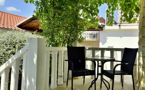 Orebić Viganj 100: Table, Property, Building, Furniture, Plant, Wood, Window, Shade, Outdoor Furniture, Chair