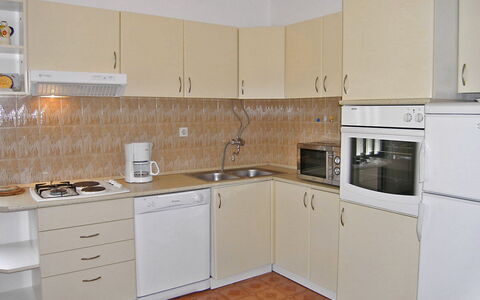 Katica: Room, Property, Kitchen, Cabinetry, Furniture, Countertop, Building, House, Major Appliance, Real Estate