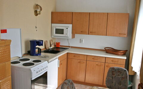 Zerna: Room, Property, Kitchen, Furniture, Major Appliance, Countertop, Cabinetry, Kitchen Stove, House, Building