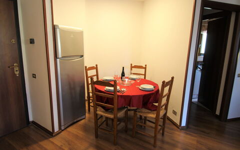 Porto Valtravaglia 115: Table, Furniture, Door, Chair, Wood, Interior Design, Building, Hall, Flooring