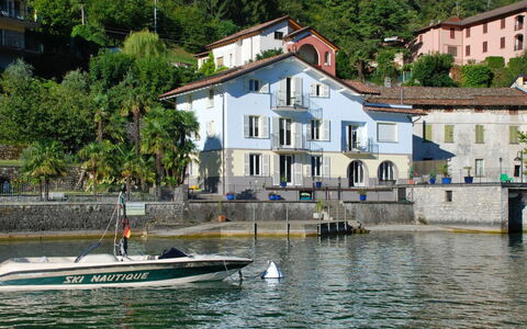 Osteno 1: Water, Building, Window, Boat, Watercraft, Tree, Lake, House, Body Of Water, Coastal And Oceanic Landforms