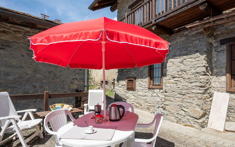 Remondet 20: Furniture, Property, Table, Chair, Umbrella, Building, Sky, Shade, Window, Outdoor Furniture