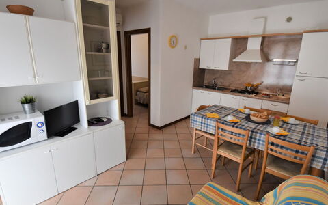 Rosolina Mare 300: Property, Cabinetry, Countertop, Interior Design, Wood, Architecture, Flooring, Floor, Living Room, Kitchen Stove
