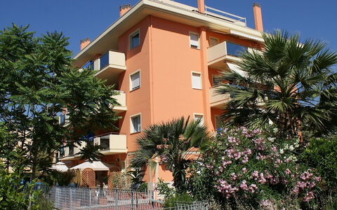 Azzurra: Plant, Sky, Building, Window, Tree, House, Arecales, Real Estate, Facade, Condominium