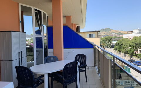 Azzurra: Table, Furniture, Property, Chair, Sky, Building, Shade, Plant, Window, Real Estate