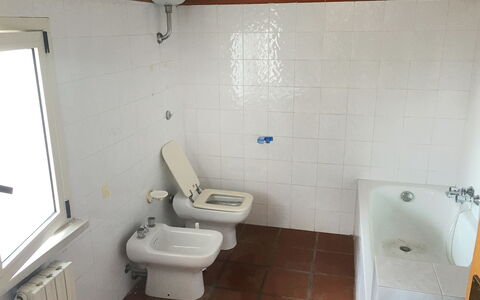 Breda: Bathroom, Toilet Seat, Property, Toilet, Room, Plumbing Fixture, Floor, Tile, Wall, Bidet