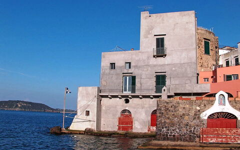Ischia Ponte 10: Sky, Blue, Landmark, Town, Architecture, Waterway, Building, Water, Sea, House