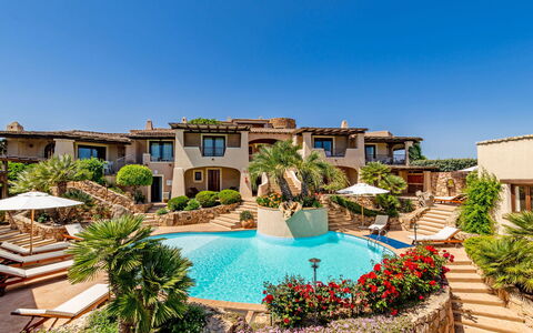 Porto San Paolo 200: Sky, Water, Plant, Building, Property, Azure, Swimming Pool, Body Of Water, Vegetation, Tree
