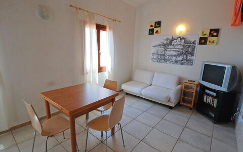 Costa Rei 100: Table, Furniture, Property, Picture Frame, Couch, Chair, Lighting, Living Room, Wood, Interior Design