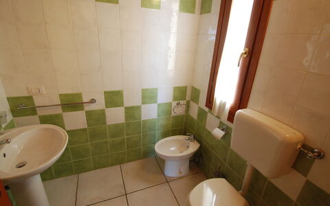 Costa Rei 100: Property, Plumbing Fixture, Toilet, Bathroom Sink, Toilet Seat, Bathroom, Building, Purple, Sink, Interior Design