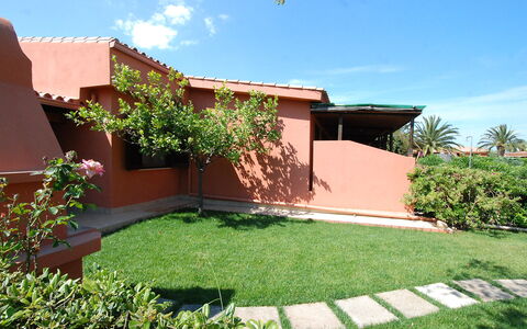Costa Rei 180: Plant, Sky, Cloud, Building, Shade, Land Lot, Brick, Tree, Grass, Neighbourhood