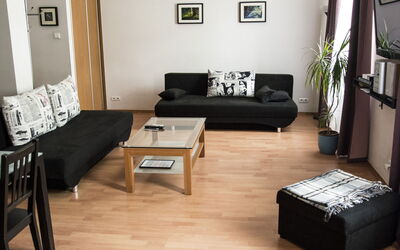 Royal Route Residence 150.5: Furniture, Living Room, Room, Floor, Black, Property, Interior Design, Couch, Coffee Table, Laminate Flooring