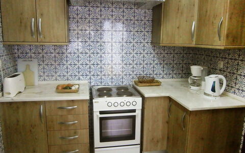 Doroteia: Countertop, Cabinetry, Room, Kitchen, Furniture, Property, Kitchen Stove, Tile, Major Appliance, Interior Design