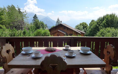 Villars 995: Table, Property, Furniture, Outdoor Table, Roof, Leisure, Restaurant, Patio, Tree, Deck
