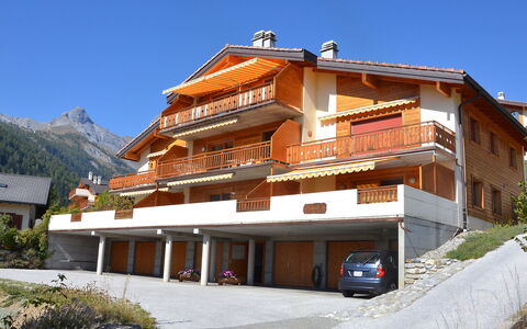 Ovronnaz 190: Sky, Plant, Building, Property, Window, House, Mountain, Tree, Wheel