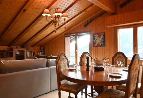 Ovronnaz 240: Table, Property, Furniture, Window, Wood, Interior Design, Lighting, Chair, Couch, Building