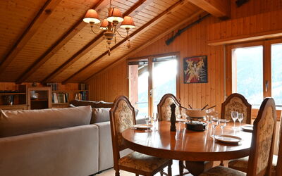 Ovronnaz 240: Table, Property, Furniture, Window, Wood, Interior Design, Lighting, Chair, Couch, Building