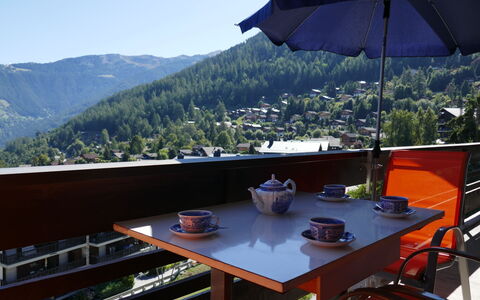 Nendaz 100: Sky, Property, Furniture, Table, Umbrella, Tableware, Mountain, Shade, Outdoor Furniture, Tree