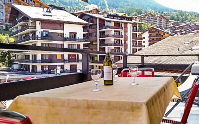 Nendaz 600: Building, Property, Window, Sky, Bottle, Mountain, Neighbourhood, House, Urban Design, Table
