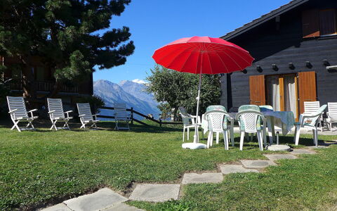 Peer Gynt: Umbrella, Sky, Red, Property, Grass, Lawn, House, Real Estate, Tree, Home