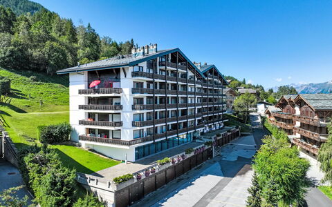 Nendaz 150: Sky, Plant, Building, Tree, Urban Design, Condominium, Mountain, Tower Block, Residential Area, Facade
