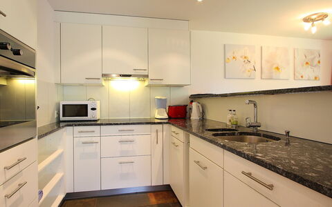 Grindelwald 106: Countertop, Room, Property, Kitchen, Cabinetry, Furniture, Yellow, Interior Design, Building, Sink