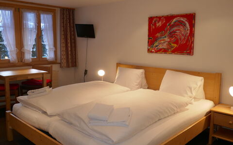 Grindelwald 150: Furniture, Property, Comfort, Window, Wood, Bed Frame, Interior Design, Building, Lighting, Pillow