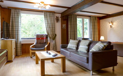 Stocki: Furniture, Building, Couch, Comfort, Wood, Interior Design, Shade, Table, Flooring, Floor