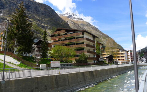 Zermatt 100: Cloud, Sky, Water, Plant, Building, Mountain, Tree, Street Light, Watercourse, Bank