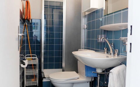 Milihaus a: Bathroom, Blue, Property, Room, Plumbing Fixture, Tile, Toilet, Wall, Yellow, Architecture